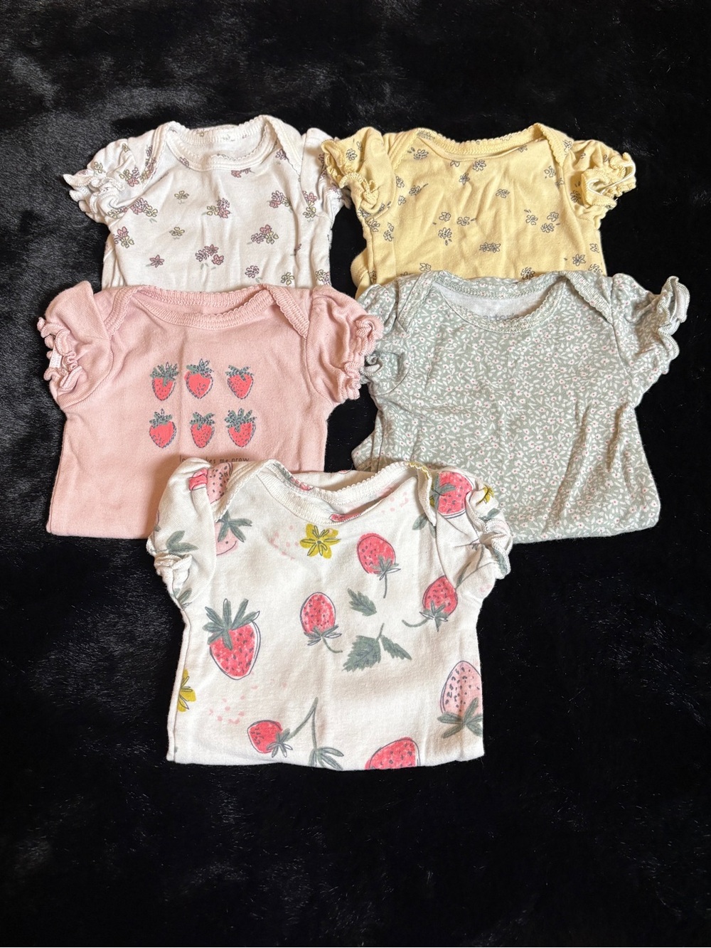 Newborn floral and strawberry onesies